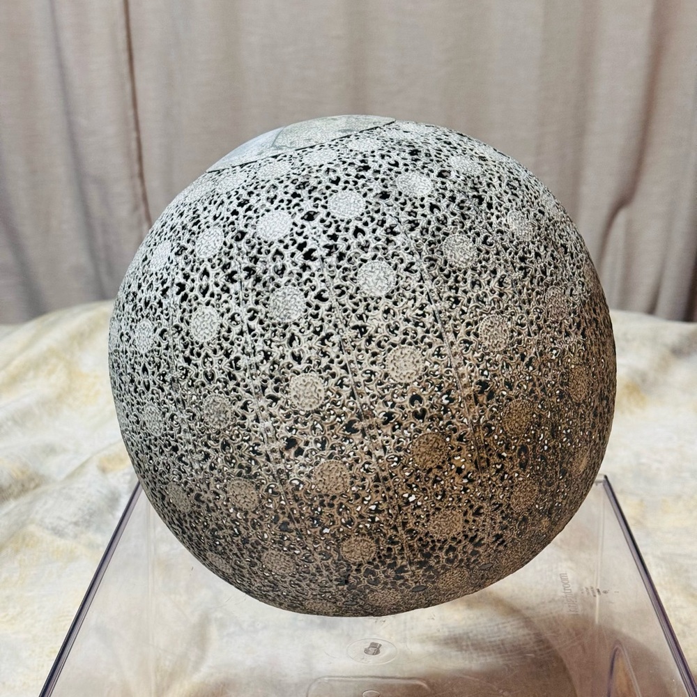 Intricate Gray Metal Sphere Art Piece